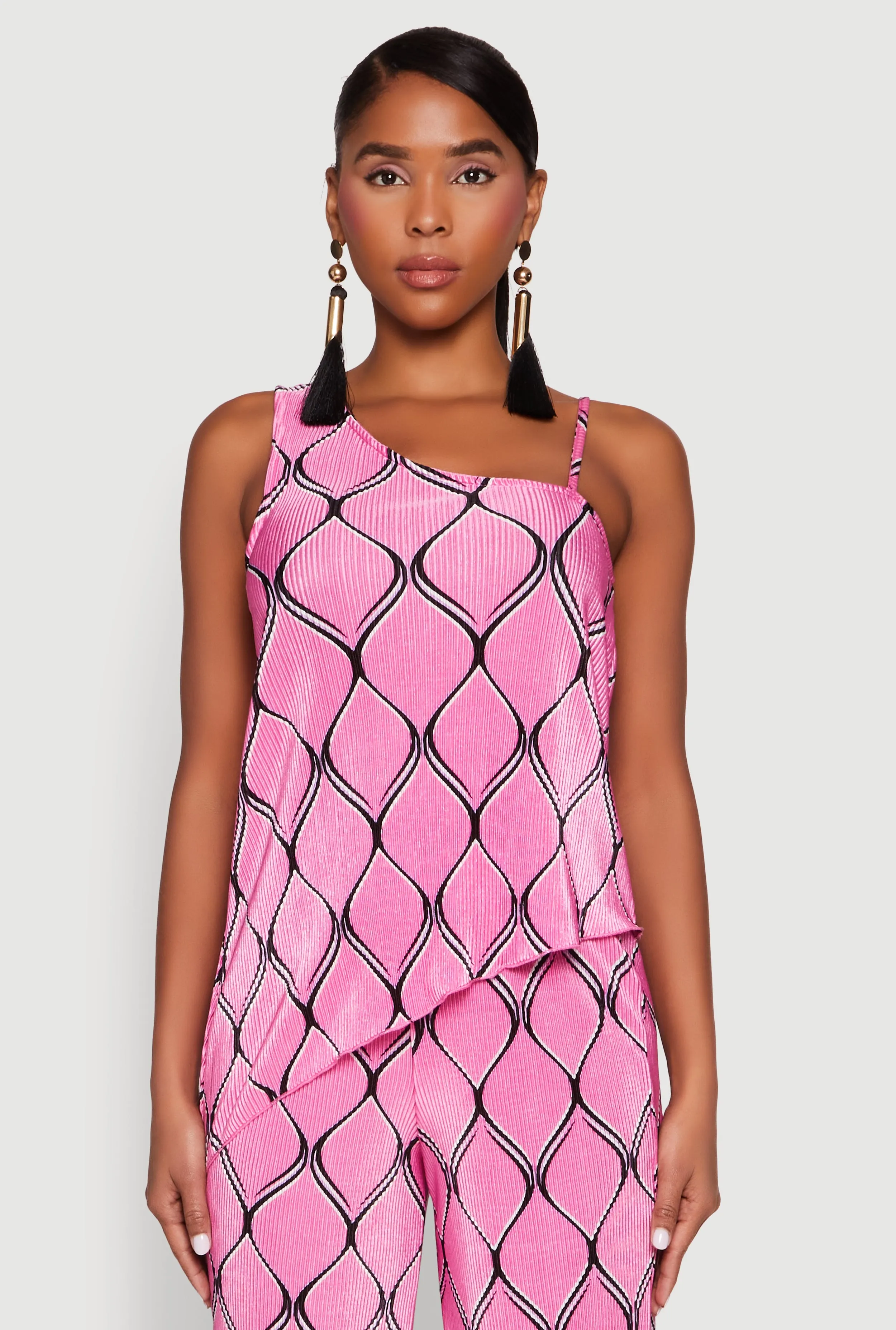 Almost Famous Plisse Asymmetrical Top sold by Rainbow