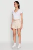 Almost Famous Buckle Detail Gingham Pleated Skort sold by Rainbow