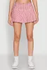 Almost Famous Buckle Detail Gingham Pleated Skort sold by Rainbow