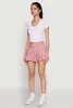 Almost Famous Buckle Detail Gingham Pleated Skort sold by Rainbow