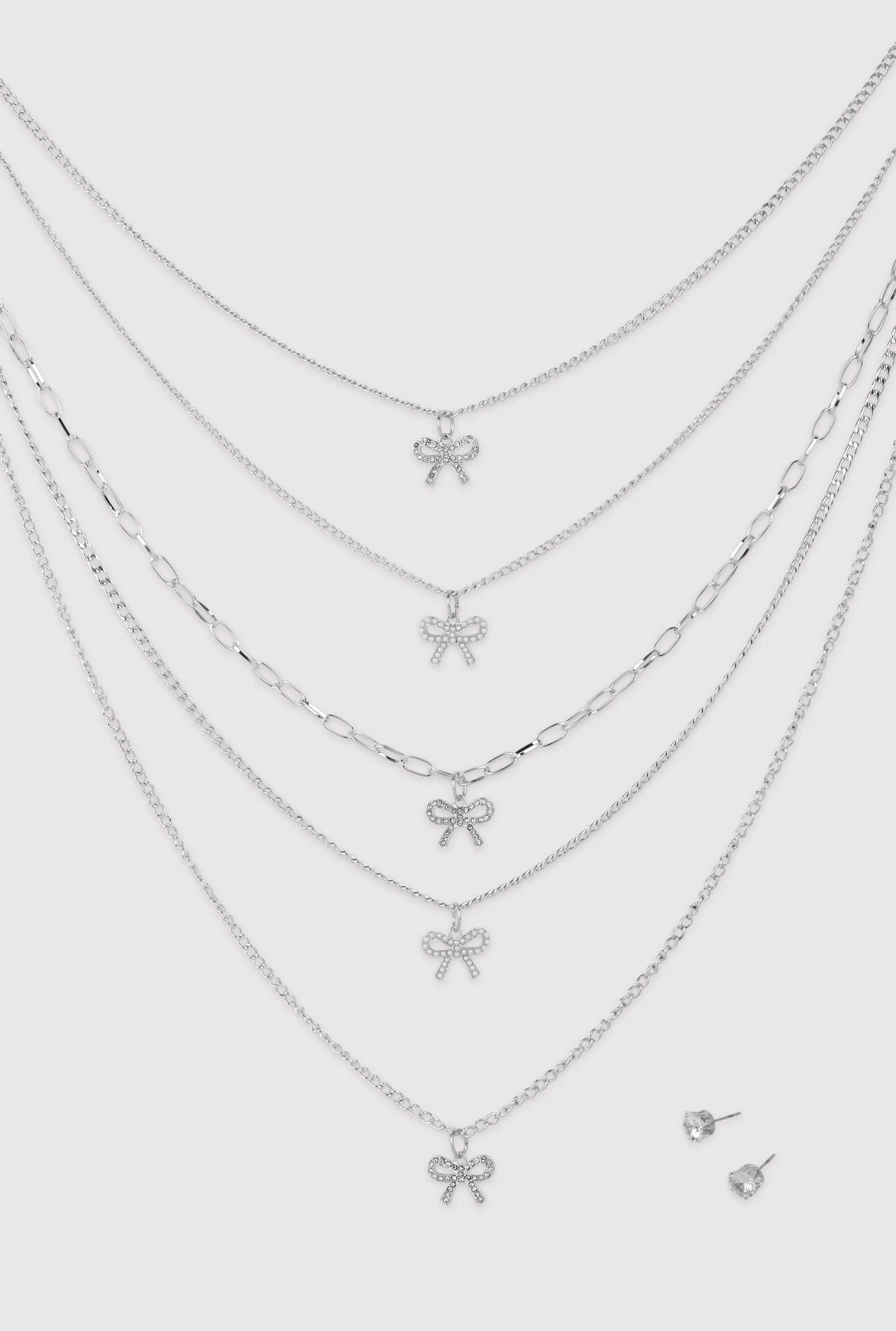 Elegant Cubic Zirconia Bow Detail Layered Necklace Set sold by Rainbow