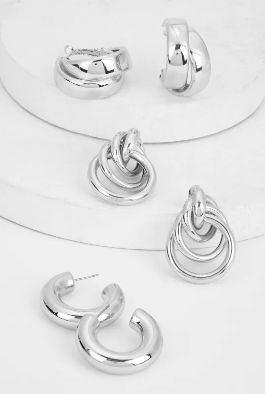 Metallic Hoop and Interlocking Drop Earrings Set of 3 sold by Rainbow