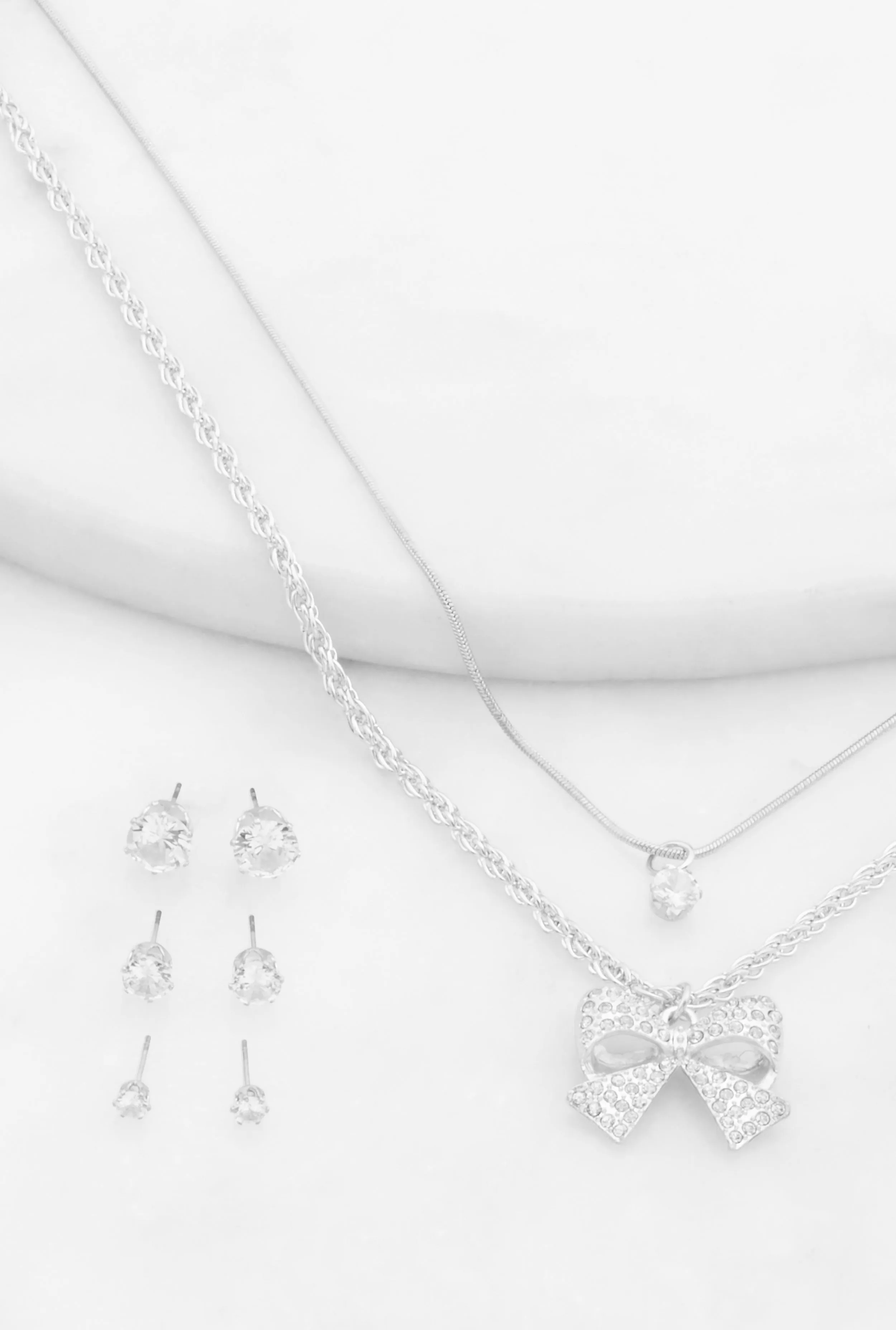 Bow Layered Necklace and Cubic Zirconia Earrings Set sold by Rainbow