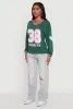 V Neck Varsity Stripe Graphic Tee sold by Rainbow