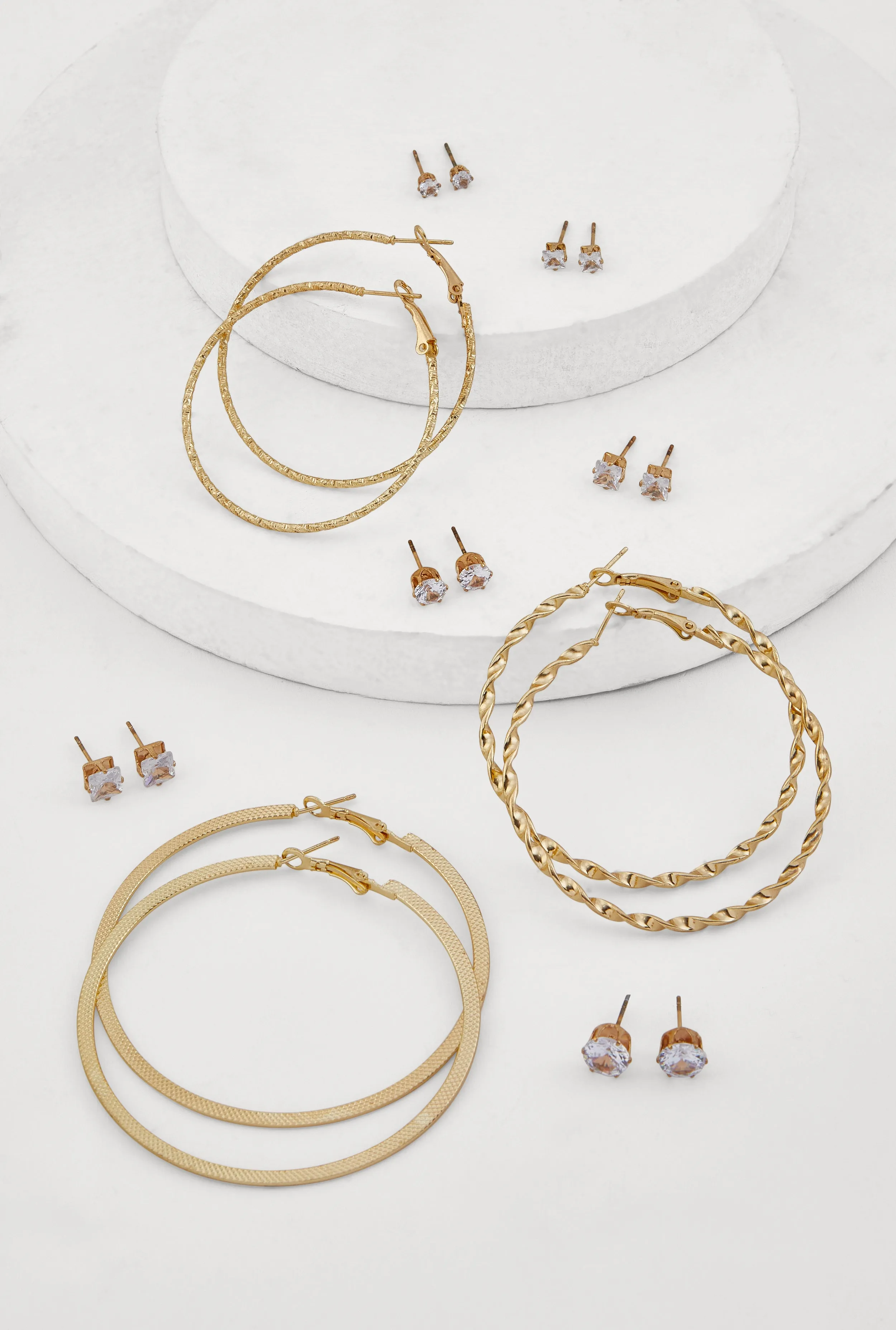Metallic Textured Hoop and Stud Earrings Set of 9 sold by Rainbow