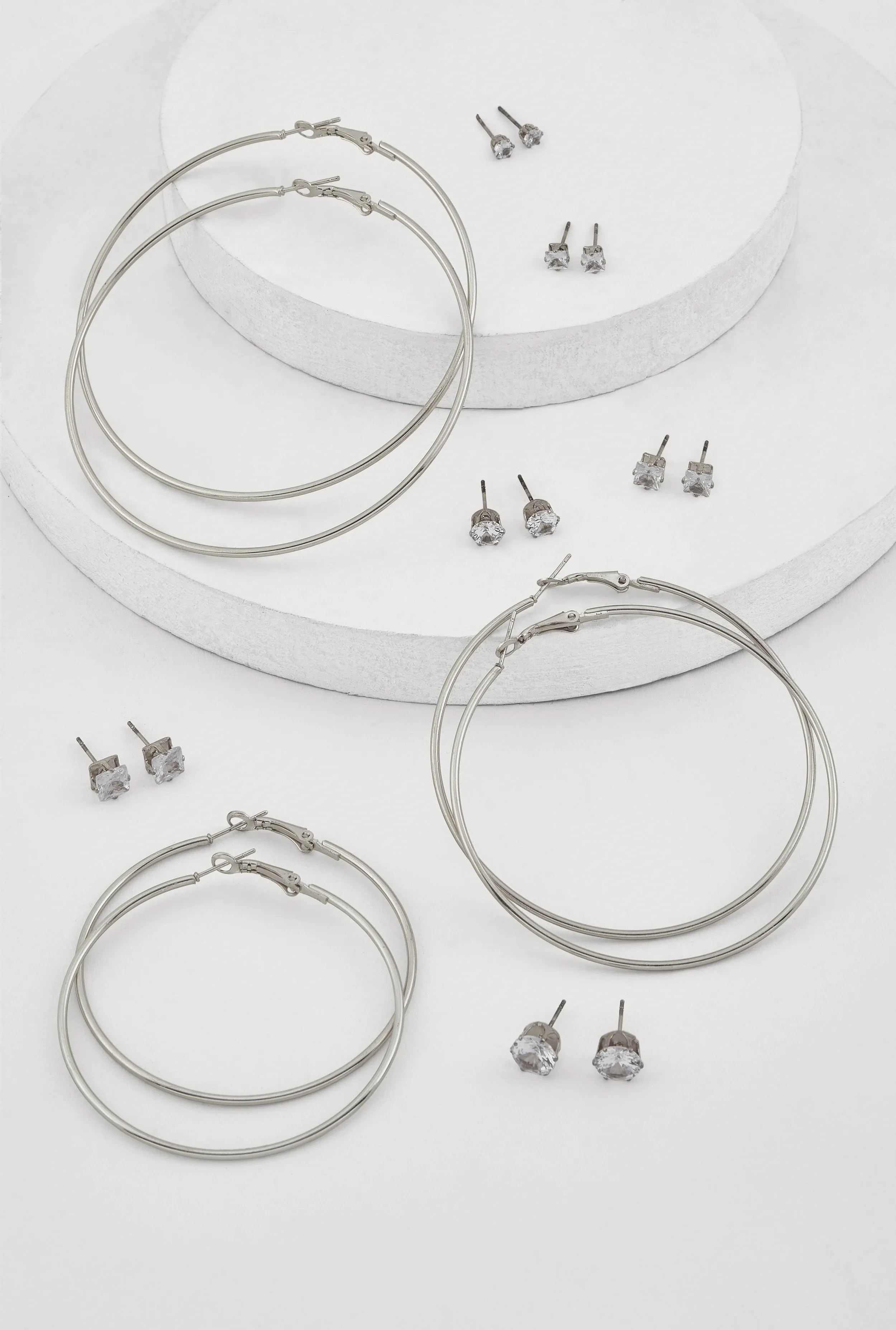 Metallic Hoop and Cubic Zirconia Stud Earrings Set of 9 sold by Rainbow