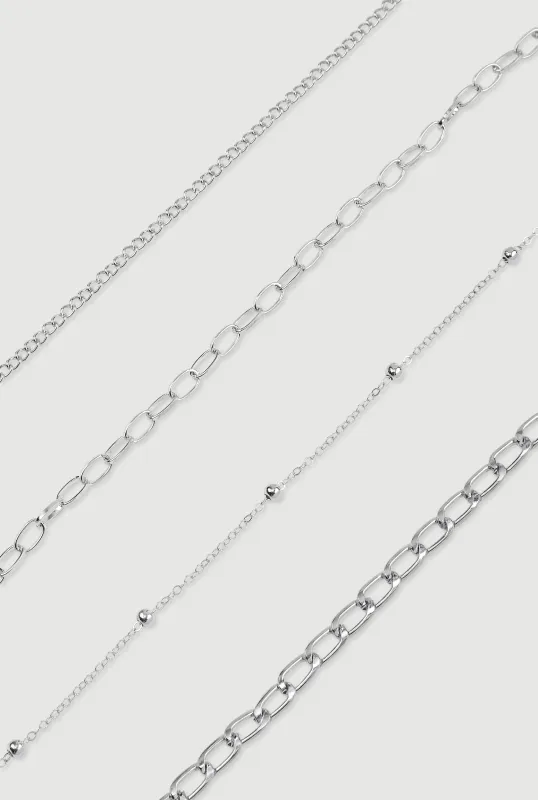 Metallic Chain Anklets Set of 4 sold by Rainbow