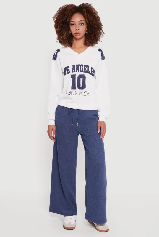 Almost Famous Elastic Hem Cropped Graphic Sweatshirt sold by Rainbow