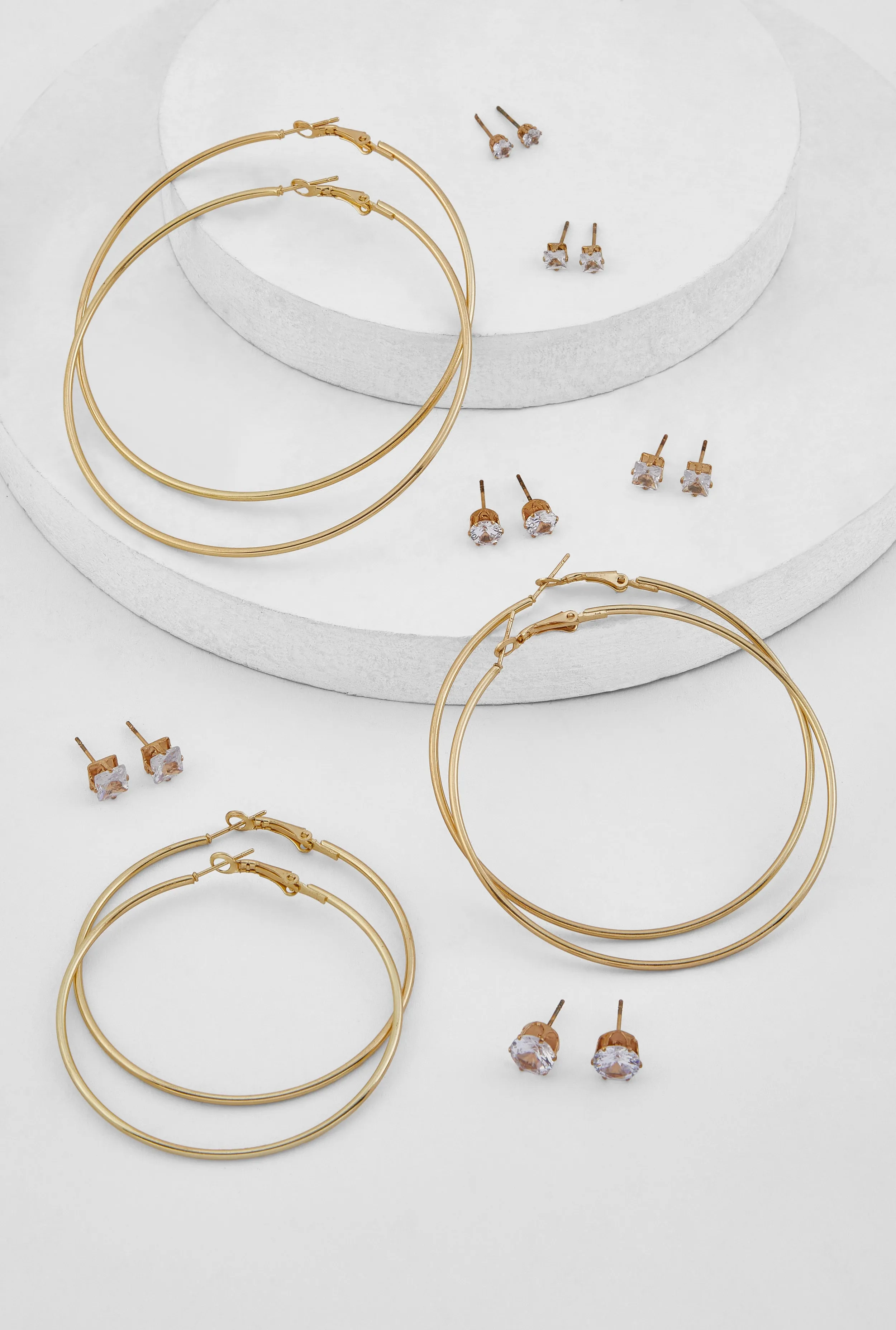 Metallic Hoop and Cubic Zirconia Stud Earrings Set of 9 sold by Rainbow