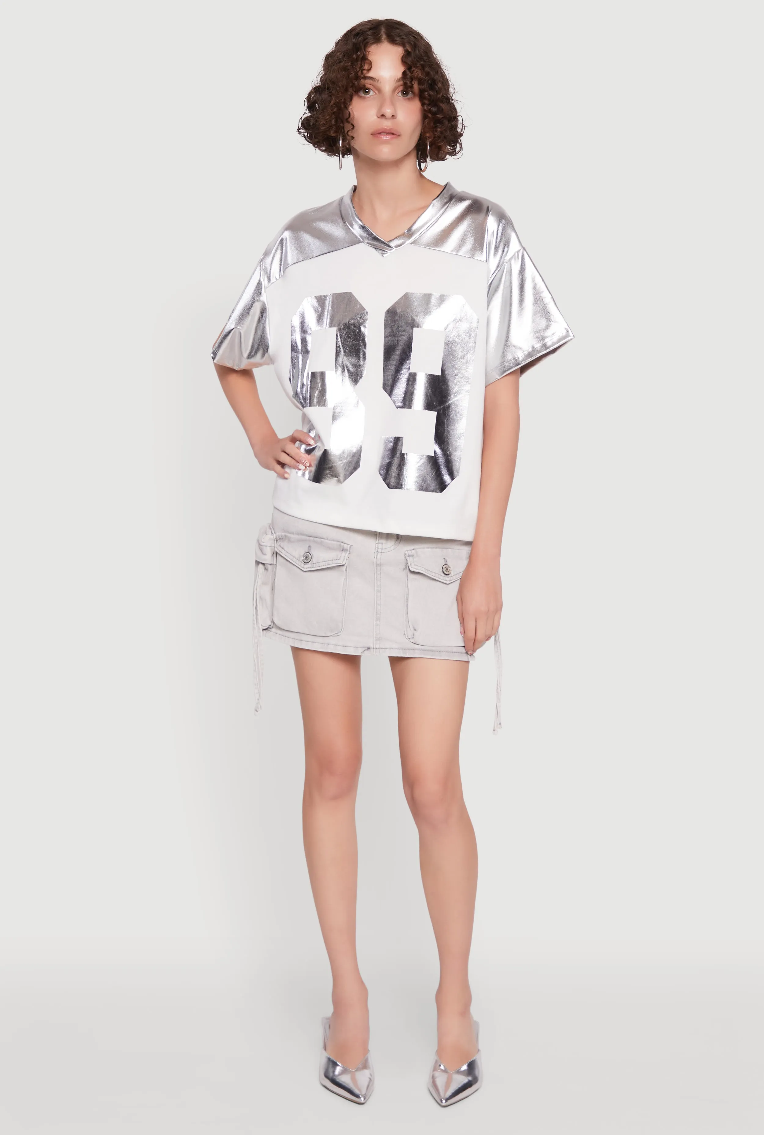 Metallic 89 Graphic Football T-Shirt sold by Rainbow