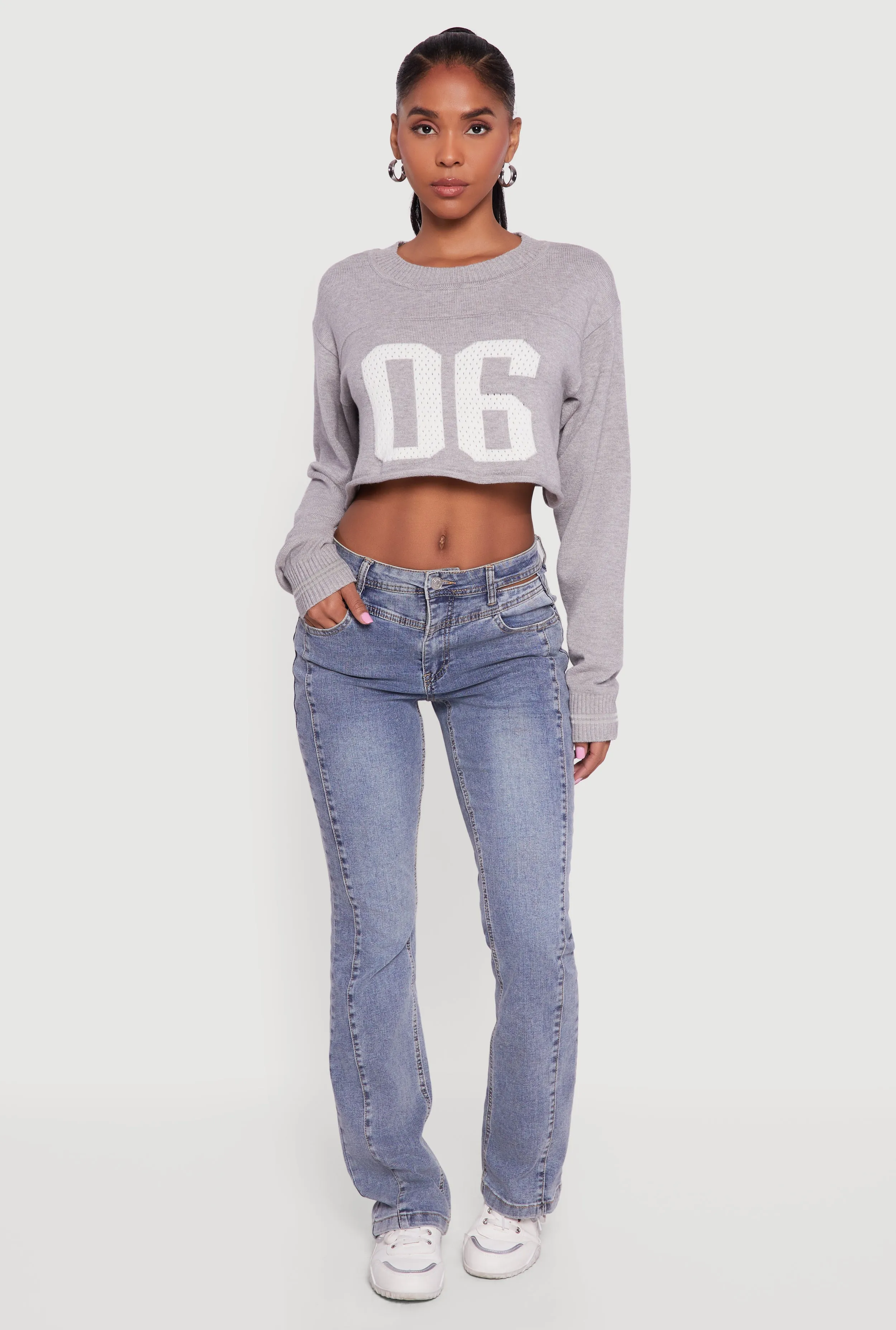 06 Graphic Varsity Stripe Detail Cropped Sweater sold by Rainbow