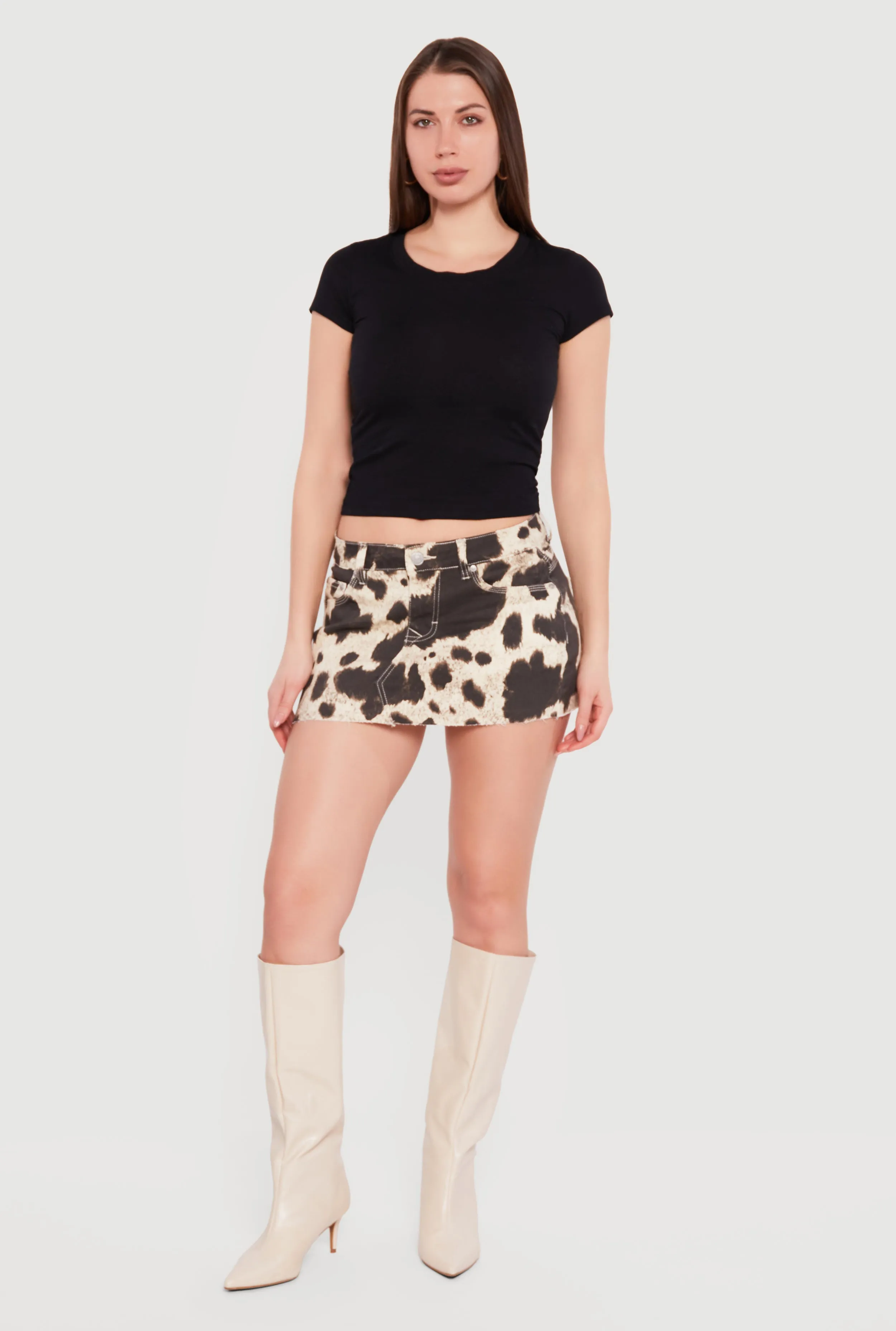 Cow Print Raw Hem Mini Skirt sold by Rainbow