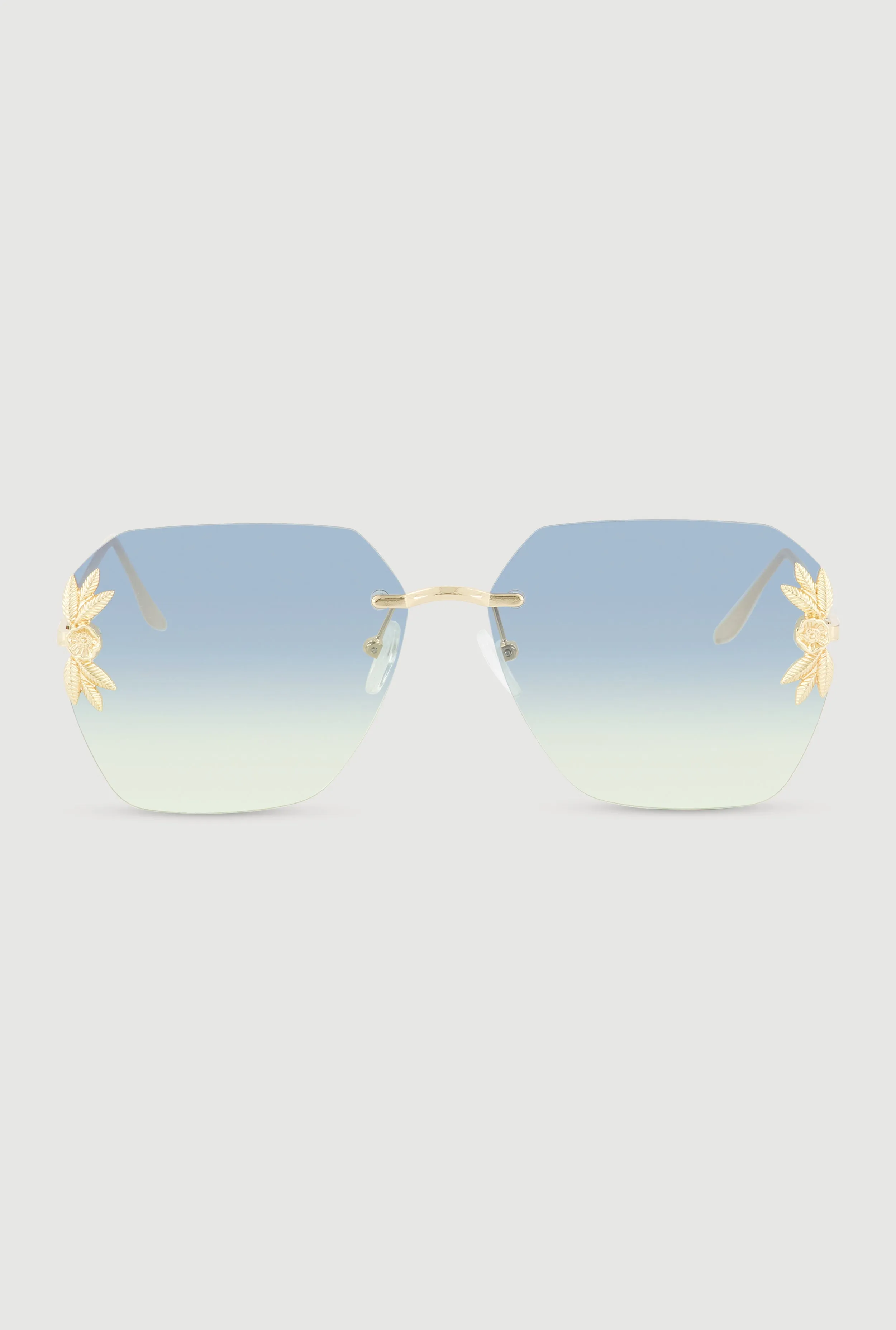 Metallic Floral Detail Rimless Sunglasses sold by Rainbow