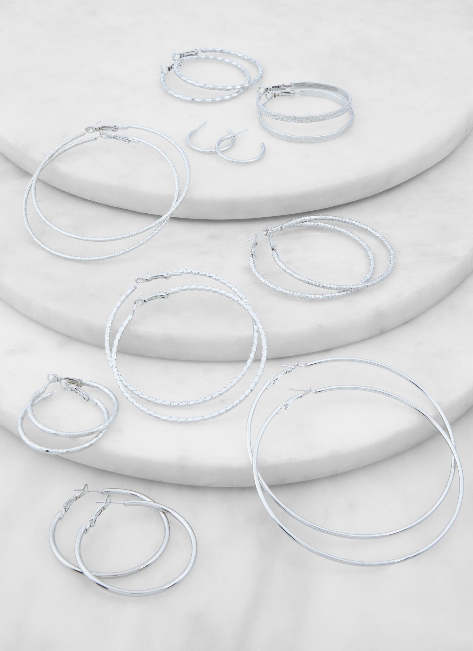 9 Pack Assorted Metallic Hoop Earrings sold by Rainbow