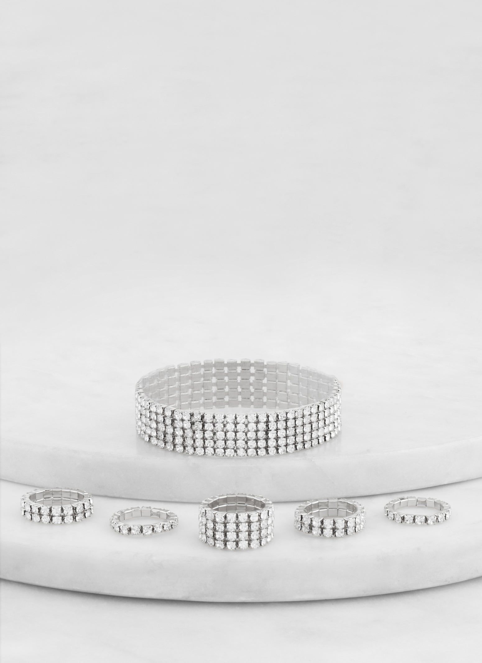 Rhinestone Tennis Bracelet and Assorted Rings sold by Rainbow