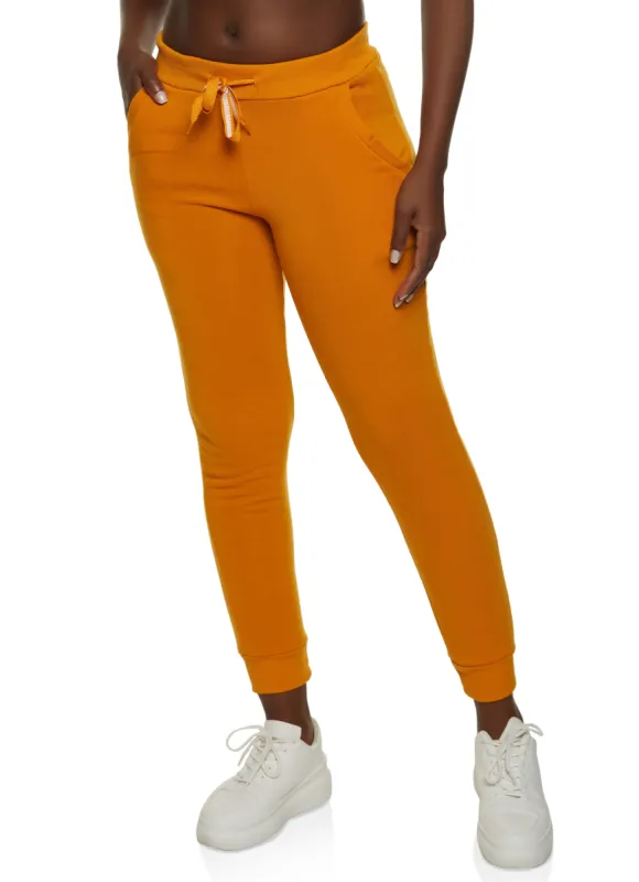 Fleece Pocket Drawstring Joggers sold by Rainbow