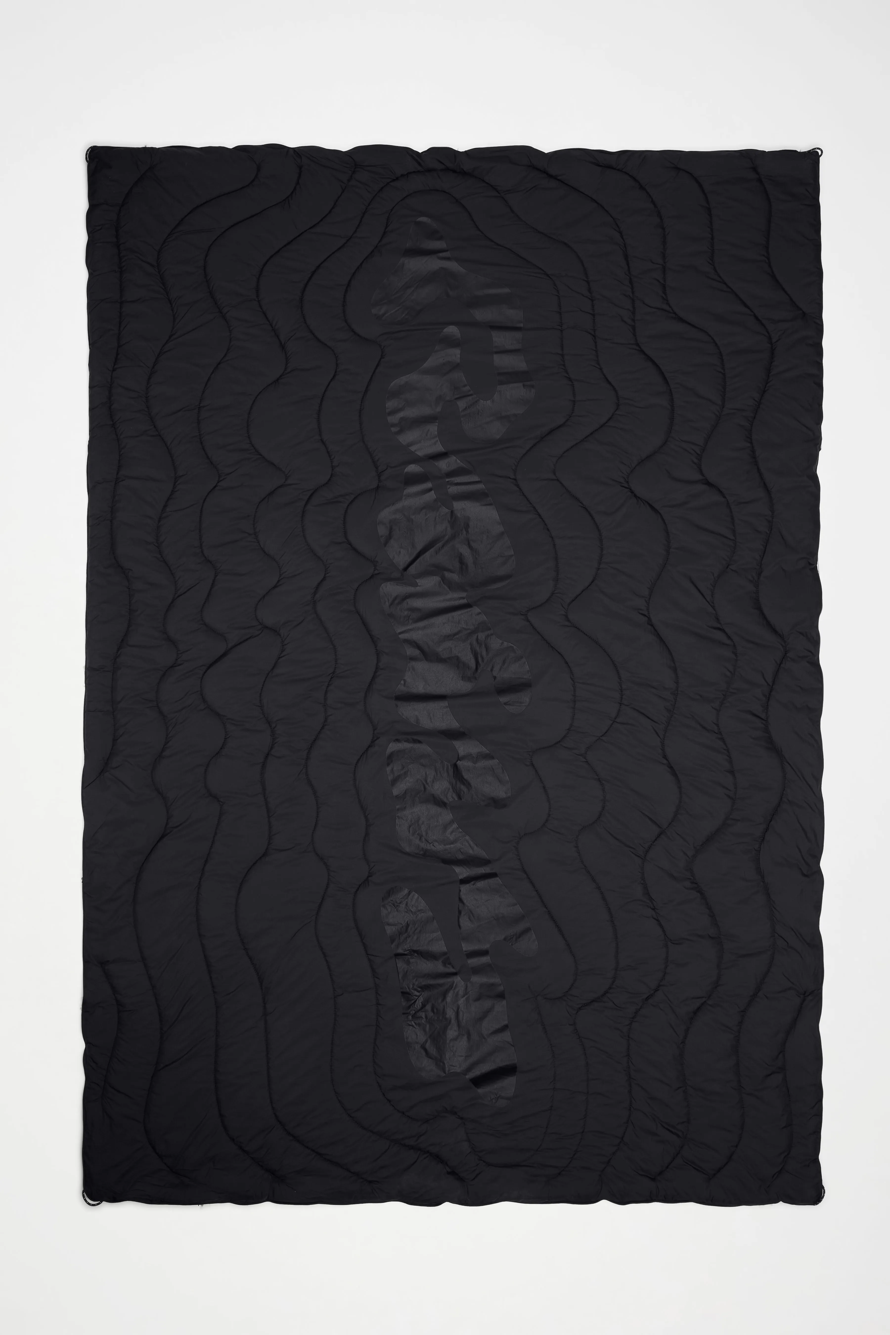 Puffer Blanket sold by Rains