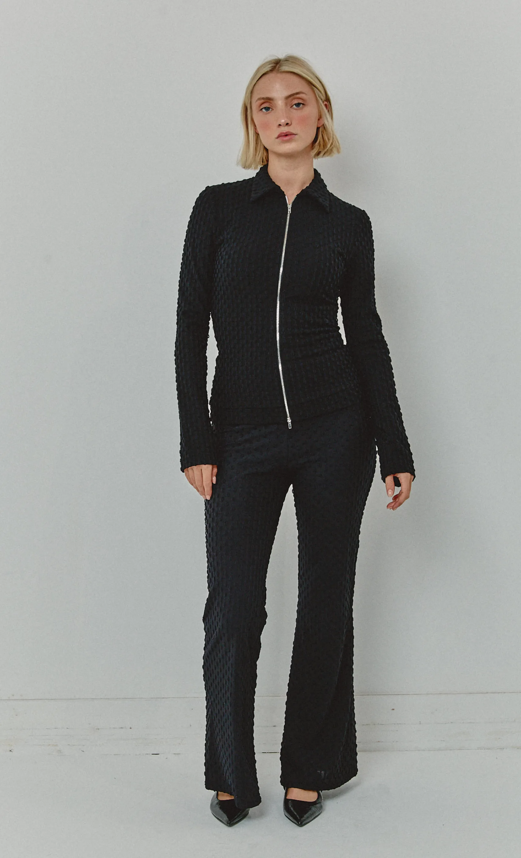 Black Textured Flared Trousers sold by Rare London
