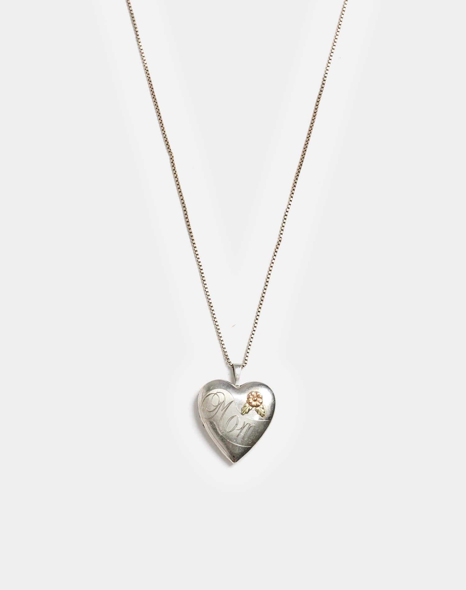 70s Sterling and 12k Rose Gold Mom Locket sold by Re/Done