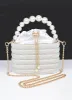Faux Pearl Handle Rhinestone Statement Bucket Clutch sold by Rebdolls