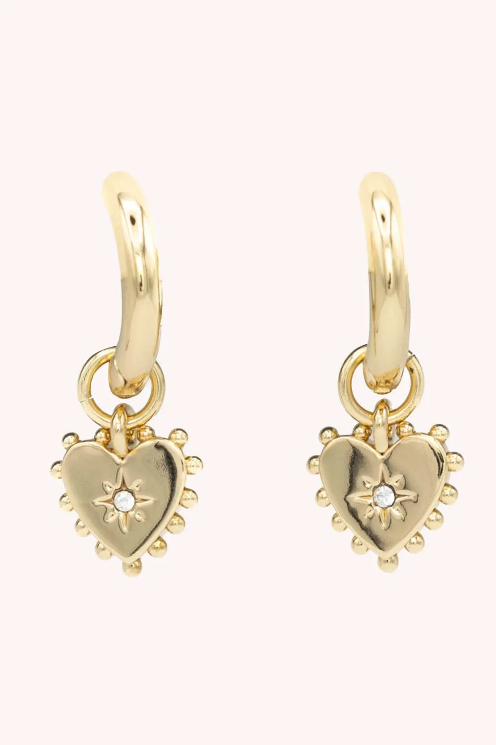 Studded Heart Huggie Hoop sold by Rebecca Minkoff