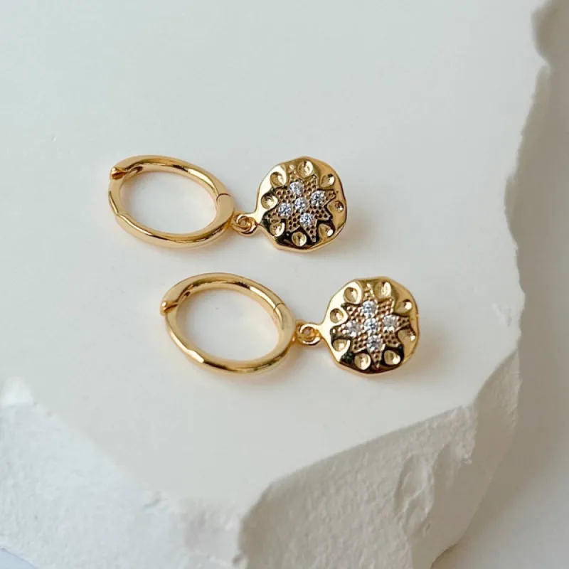 Horace Jewelry - Hoop earrings with a round design pendant containing zircon Dio sold by Reitmans