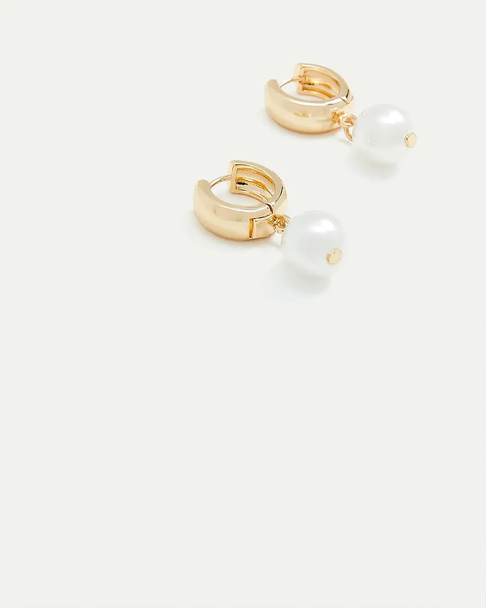 Hoops with Pearl Pendants sold by Reitmans