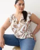 Sleeveless Split-Neck Blouse with Ruffled Shoulders sold by Reitmans