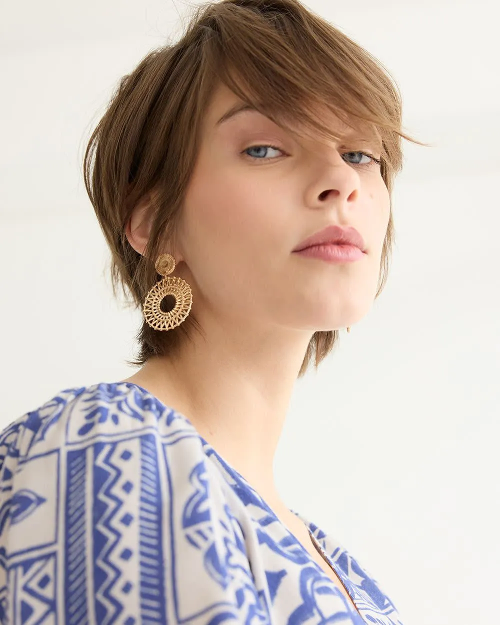 Earrings with Metal Weave Pendants sold by Reitmans