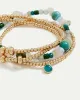 Beaded Elastic Bracelets with Charms - Set of 4 sold by Reitmans