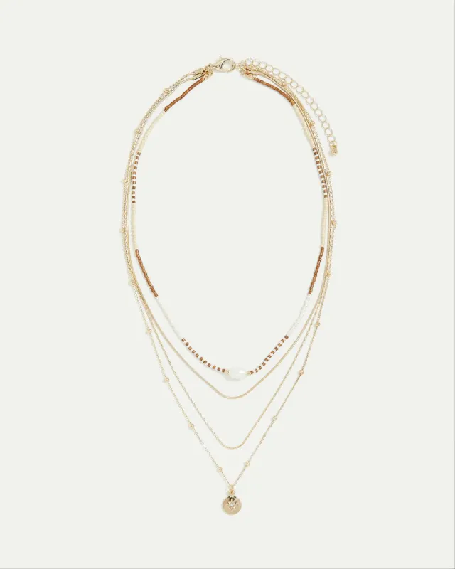 Multi-Chain Short Necklace with Pearls and Beads sold by Reitmans