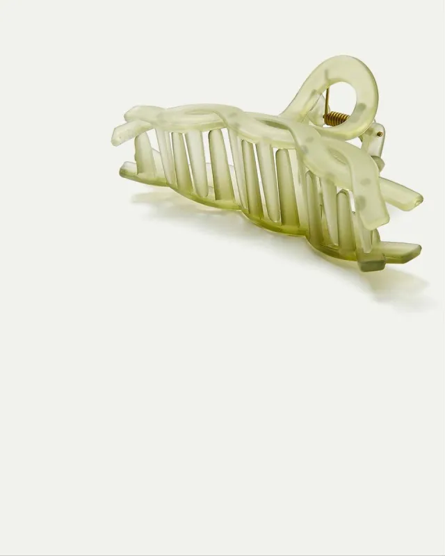 Frosted Braided Claw Clip sold by Reitmans
