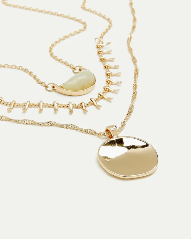 Three-Chain Necklace with Half-Moon Stone Pendant sold by Reitmans