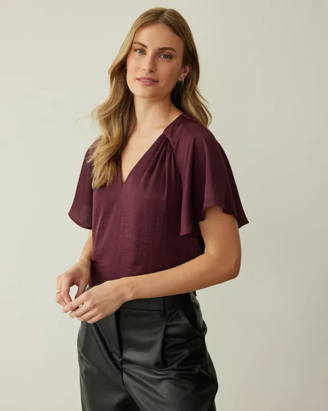 Short-Flutter-Sleeve V-Neck Blouse sold by Reitmans