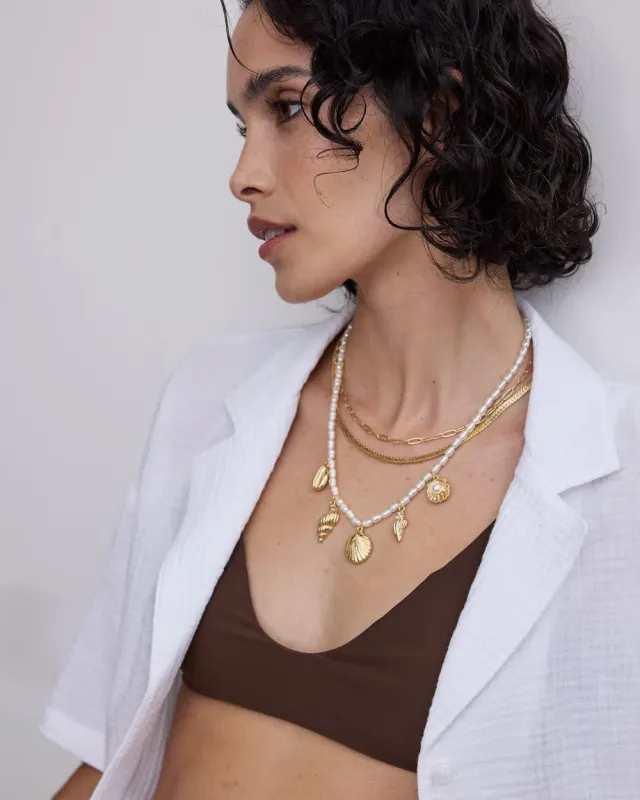 Multilayer Short Necklace with Pearls and Seashell Charms sold by Reitmans