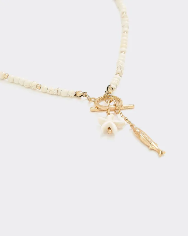 Short Necklace with Fish Charms sold by Reitmans