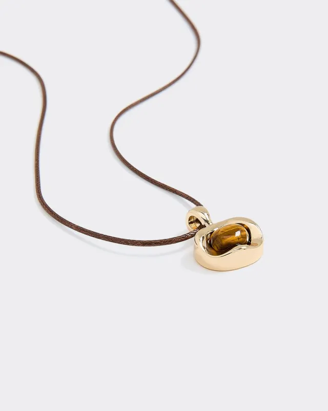 Short Cord Necklace with Tiger Eye sold by Reitmans