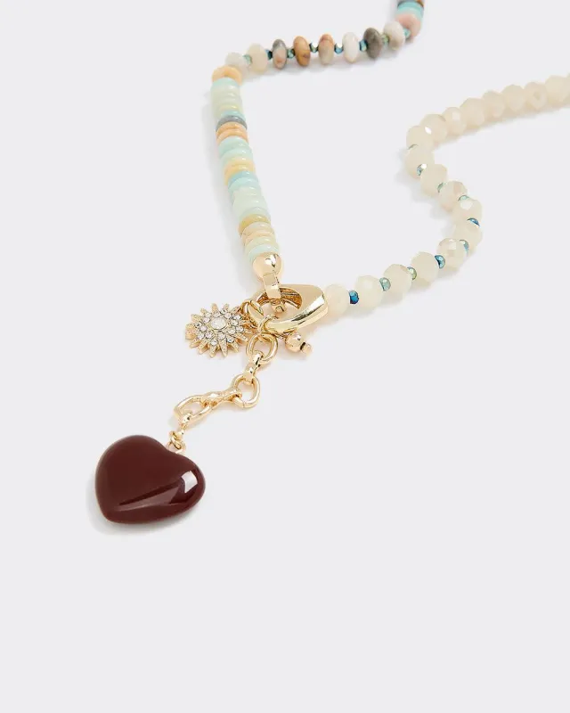 Beaded Necklace with Heart Pendant sold by Reitmans