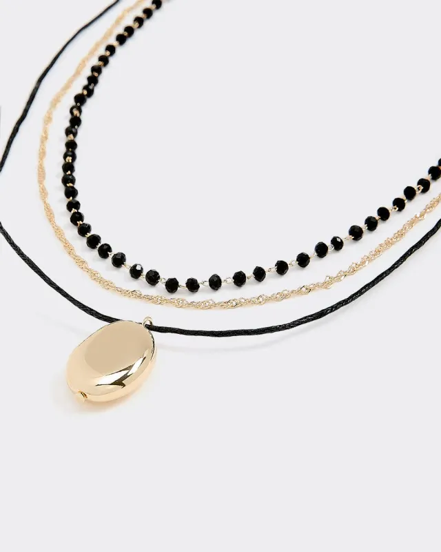 Triple-Chain Short Necklace with Pendant sold by Reitmans