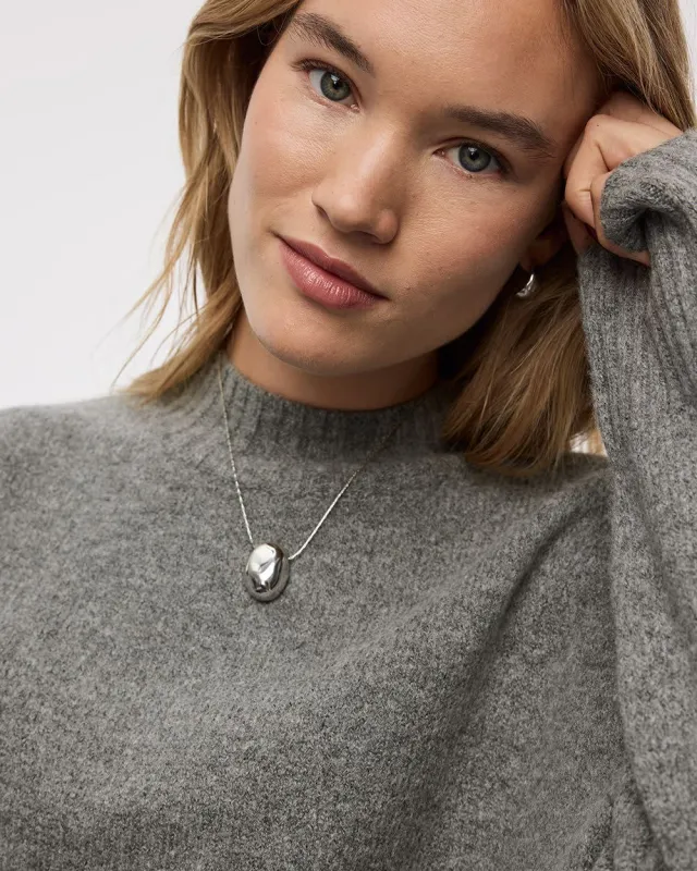 Long Necklace with Oval Metal Pendant sold by Reitmans