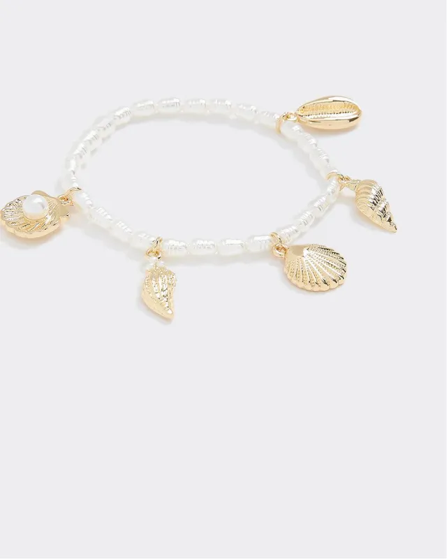 Pearl Bracelet with Seashell Charms sold by Reitmans