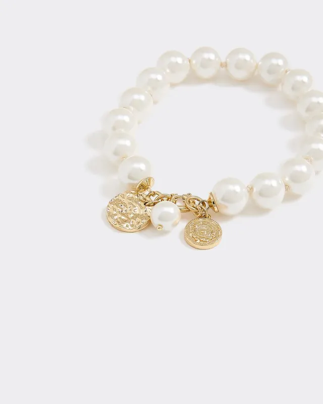 Pearl Bracelet with Charms sold by Reitmans