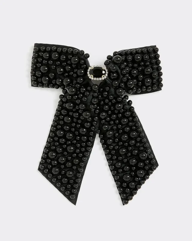 Bow Hair Clip with Black Beads sold by Reitmans