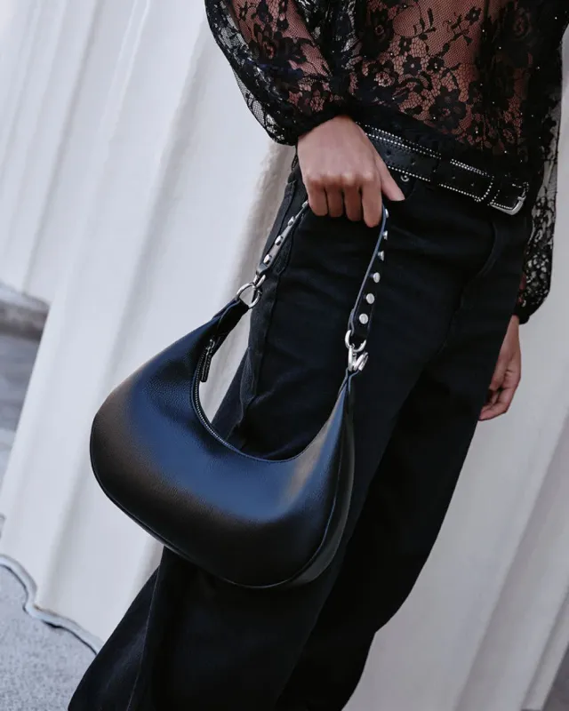 Half-Moon Bag with Studded Strap sold by Reitmans