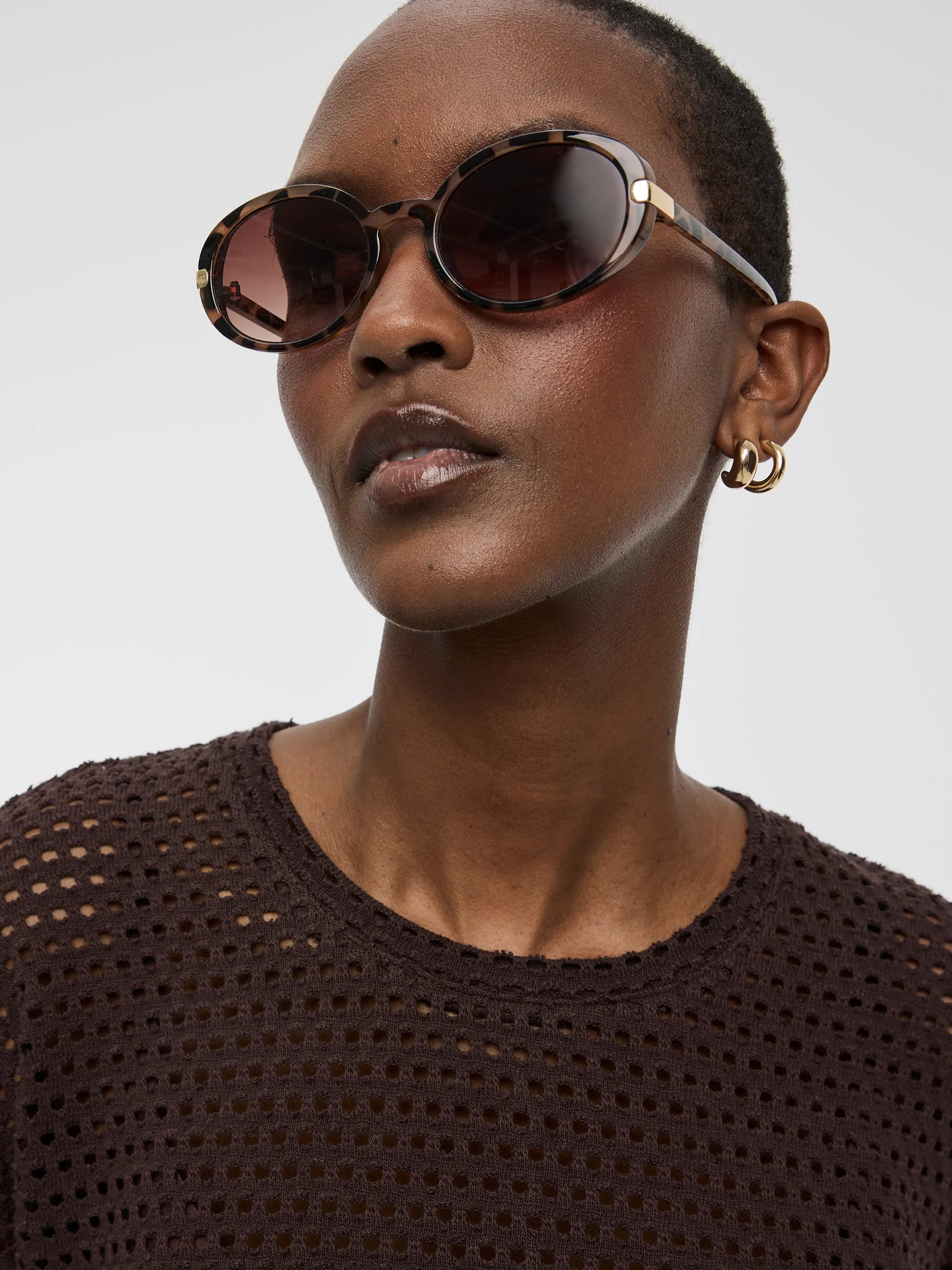 Oval Sunglasses sold by Reitmans