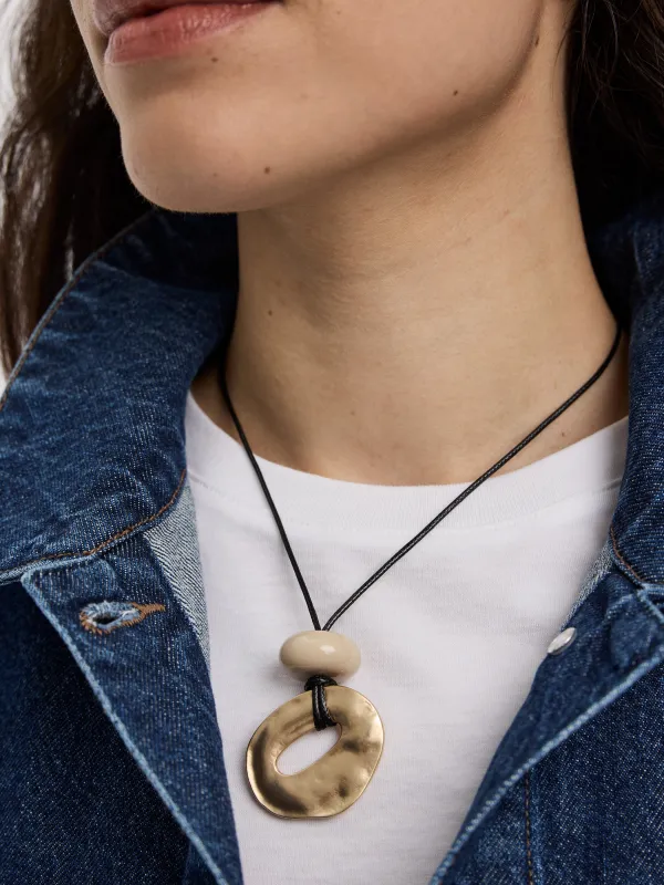 Cord Necklace with Metal Pendant and Stone sold by Reitmans