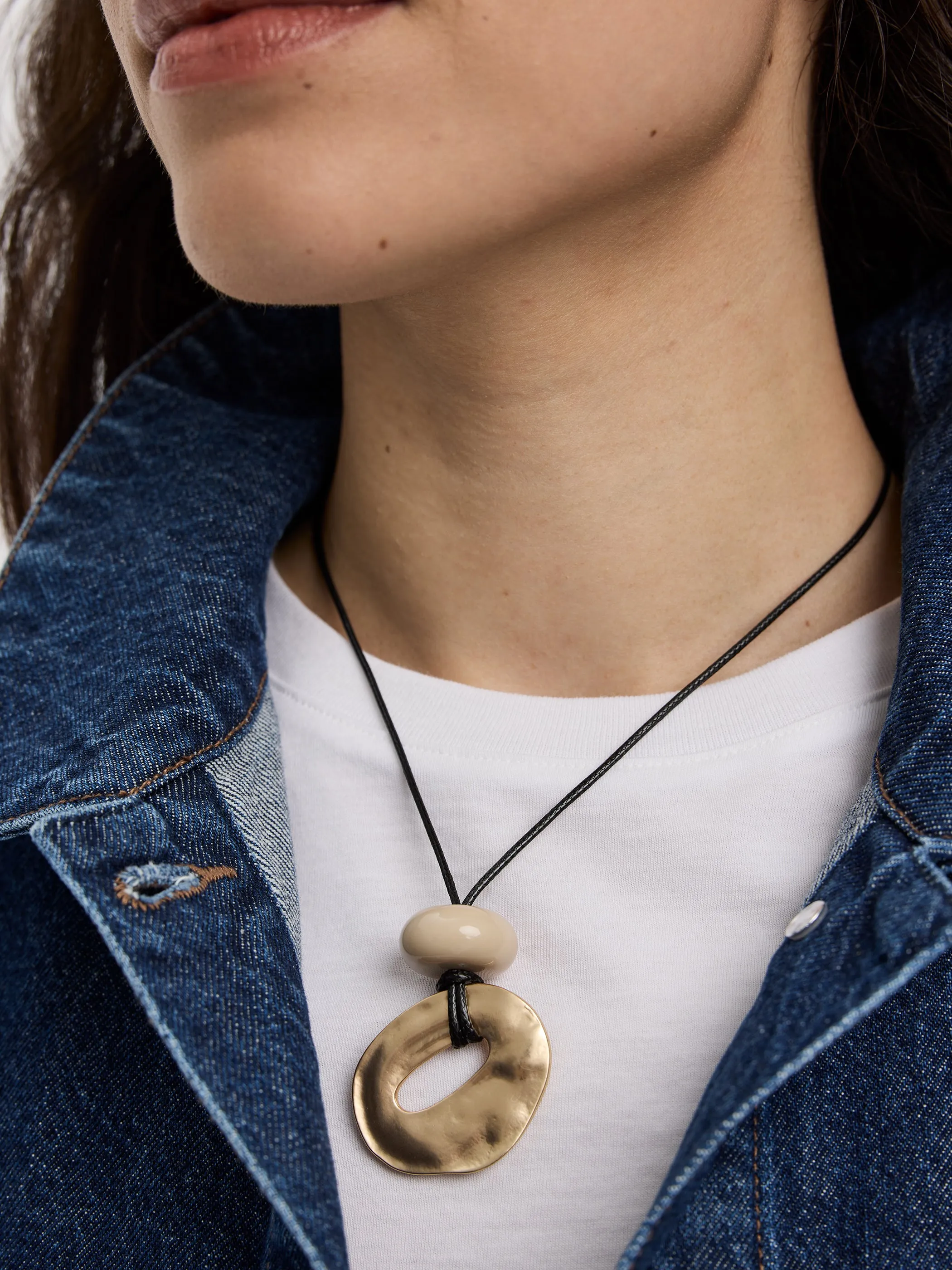 Cord Necklace with Metal Pendant and Stone sold by Reitmans