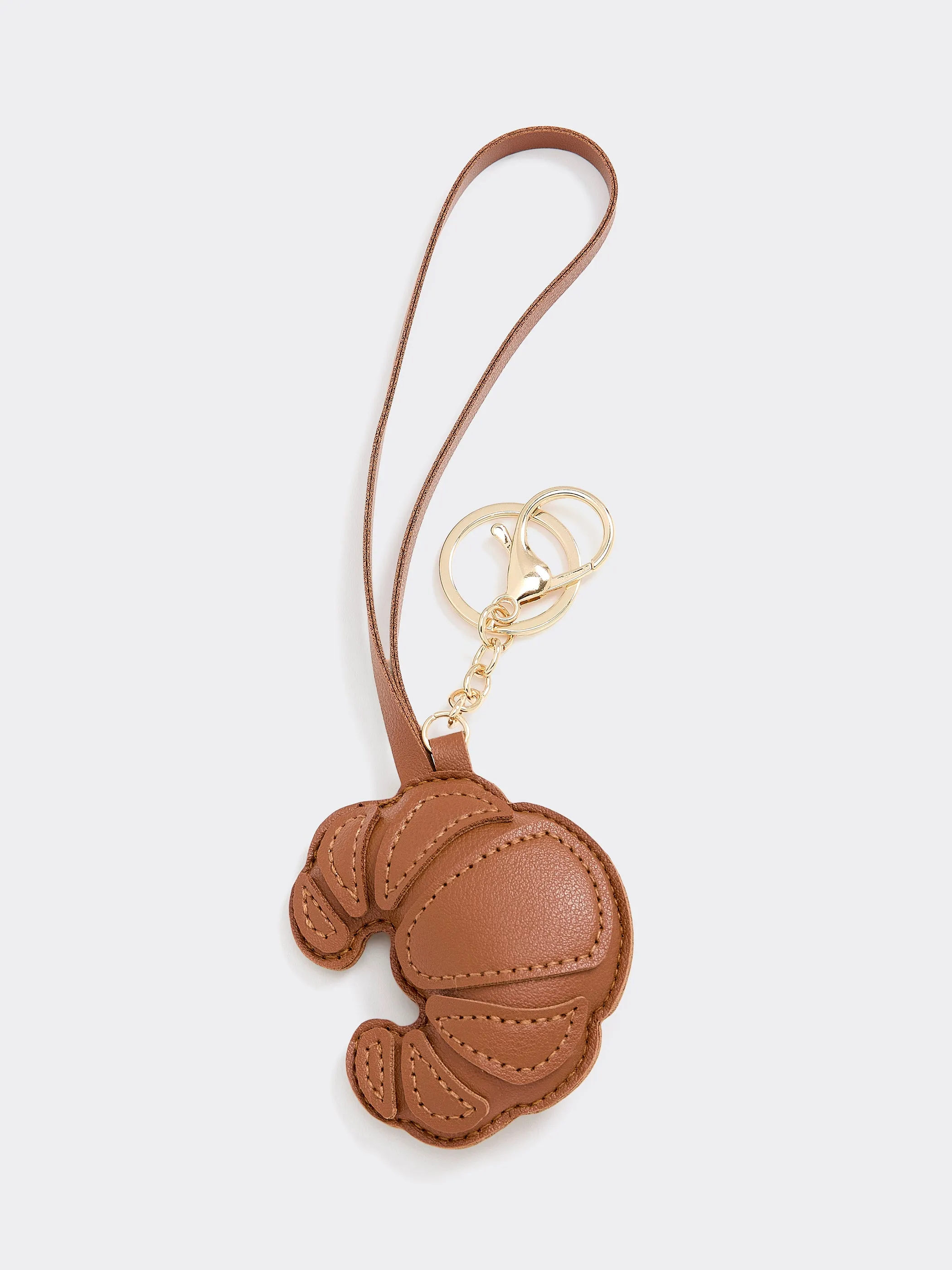 Faux Leather Croissant Bag Charm sold by Reitmans