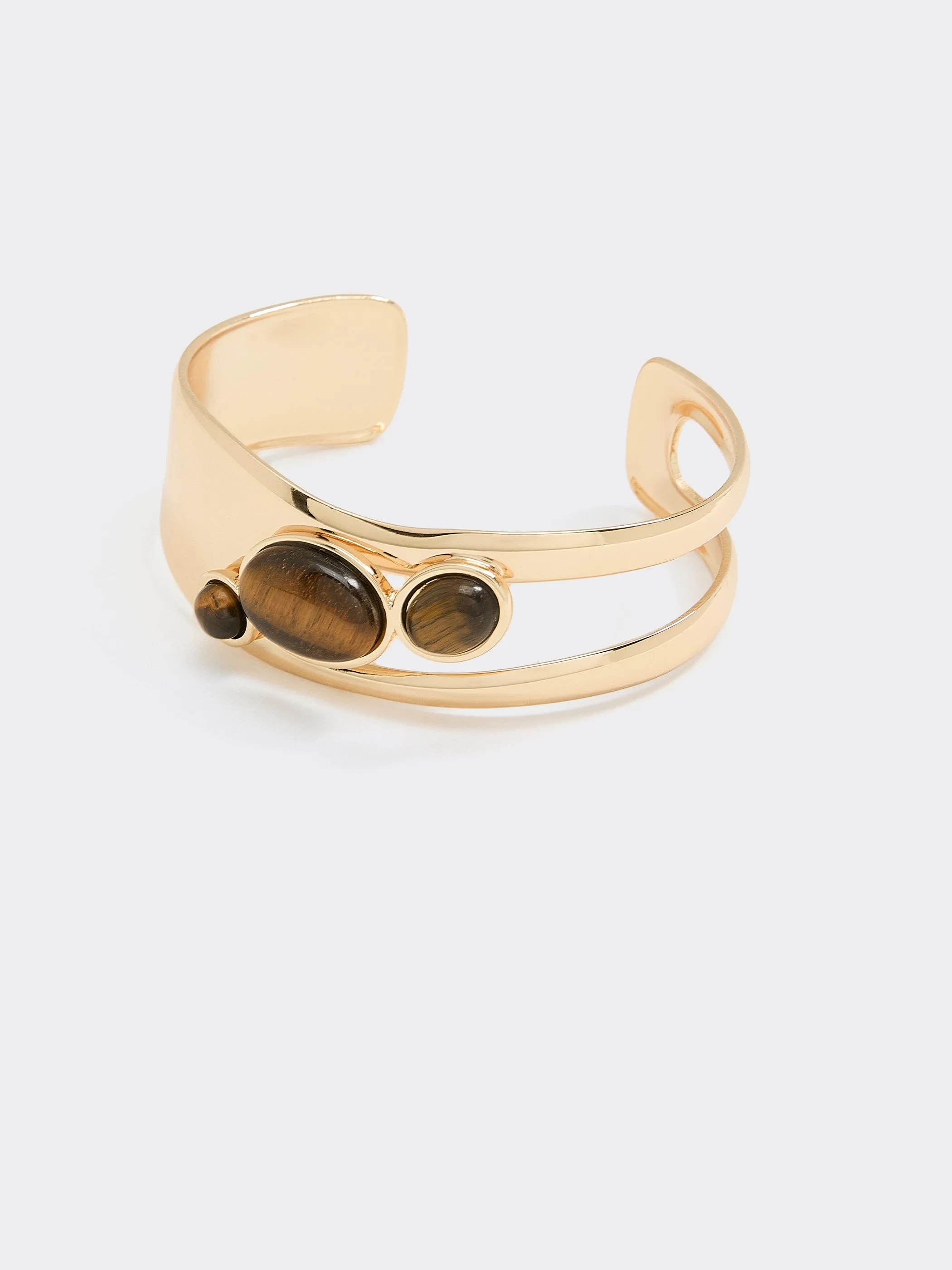 Bangle Bracelet with Tiger Eyes sold by Reitmans