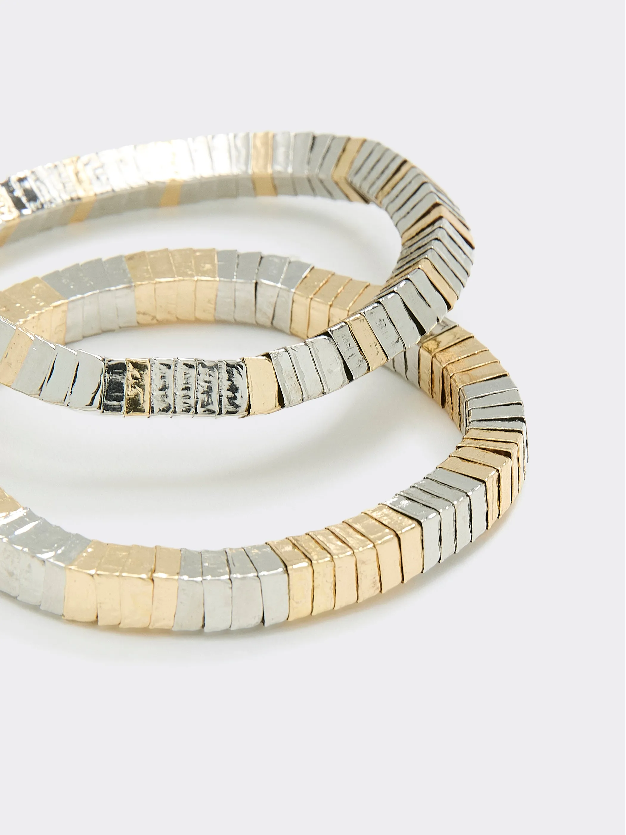 Two-Tone Metallic Bracelets - Set of 2 sold by Reitmans